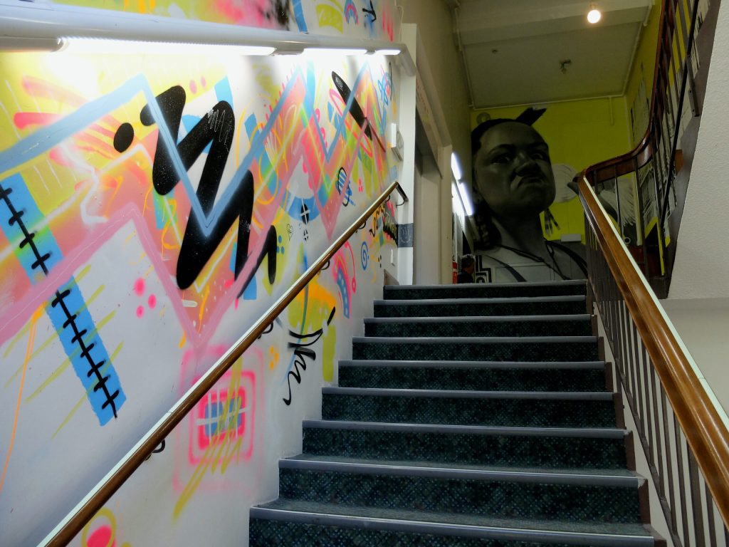 Murals on a staircase at Canterbury Museum